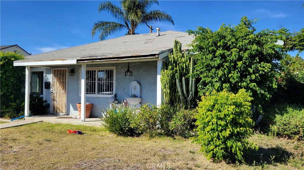 2201 West Raymond Street Compton, CA 90220 - Photo 1 of 1 front view of a house with a small yard