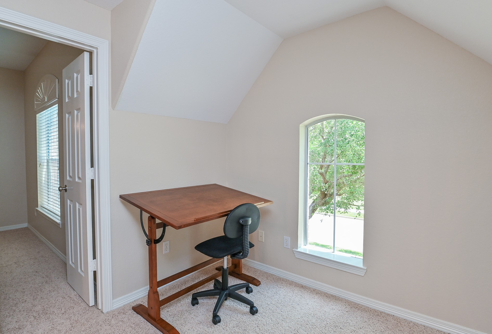 7218 Spring Run Lane Katy, TX 77494 - Photo 28 of 49 a view of a workspace with furniture and a window