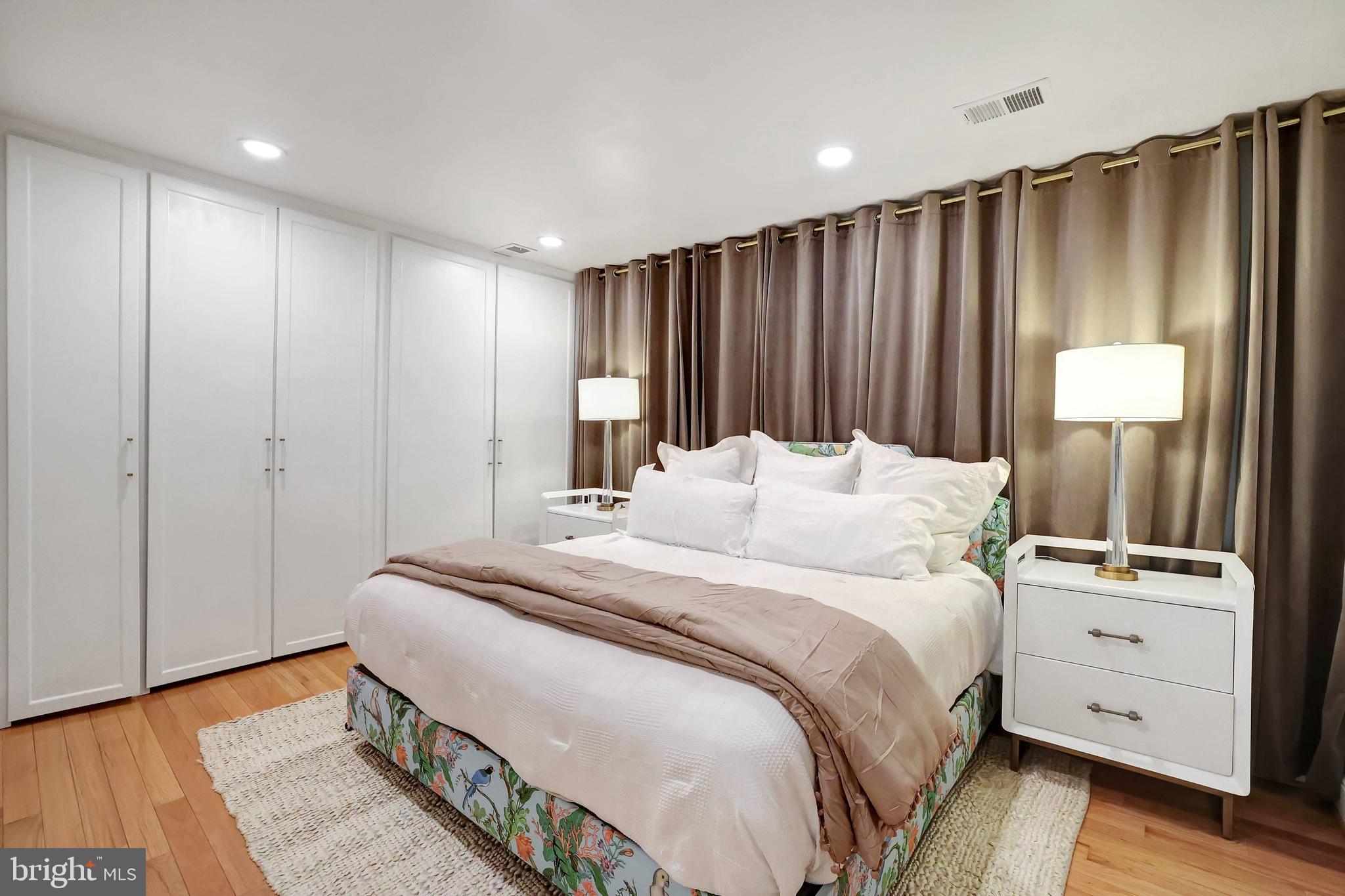 708 I Street Southeast Washington, DC 20003 - Photo 22 of 44 Primary Bedroom w/ King Bed & Custom Drapery Wall