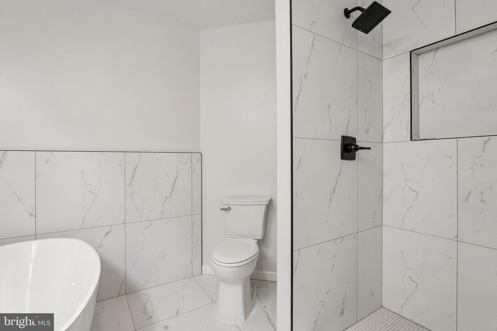 1992 Retta Gilliam Court Southeast Washington, DC 20020 - Photo 17 of 22 a bathroom with a toilet and a shower