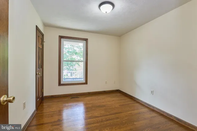 a bathroom with a toilet sink and shower