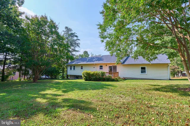 a view of house with yard