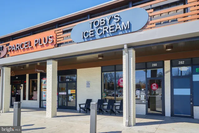 a sign board with yard in front of it