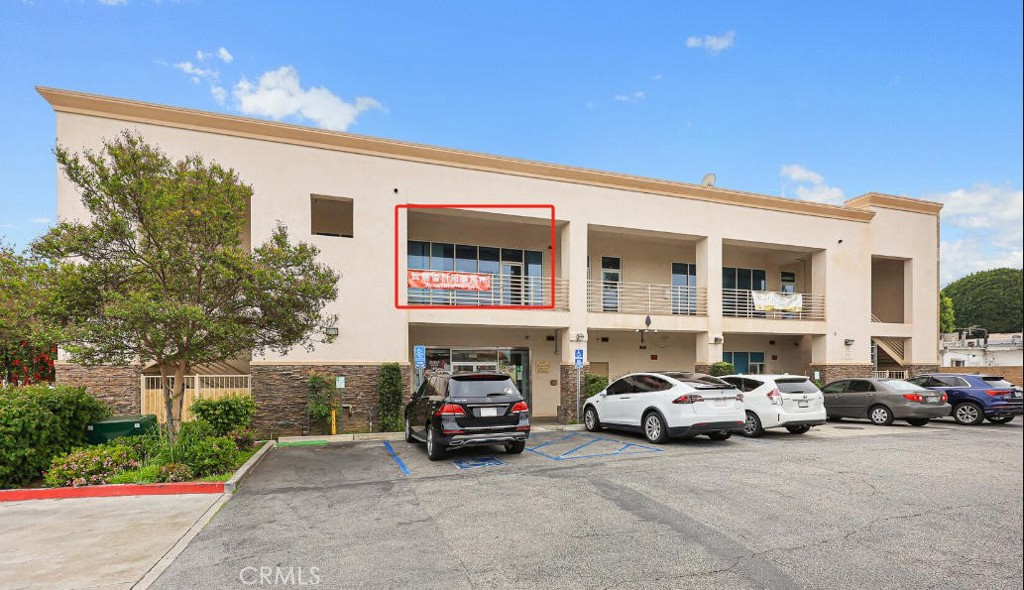 745 East Garvey Avenue, Unit 201 Monterey Park, CA 91755 - Photo 2 of 6 a view of a cars parked in front of a building