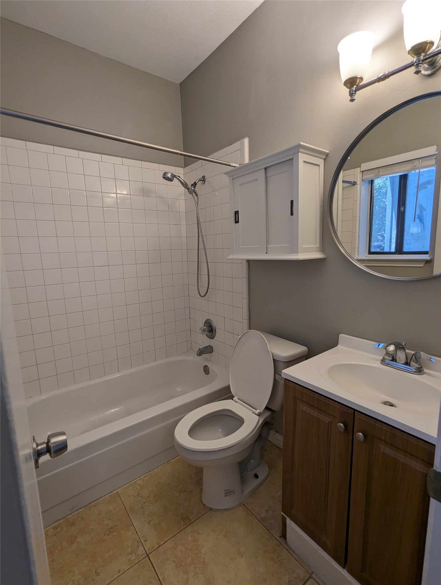 601 Nelray Boulevard, Unit 3 Austin, TX 78751 - Photo 7 of 12 a bathroom with a sink a toilet and shower