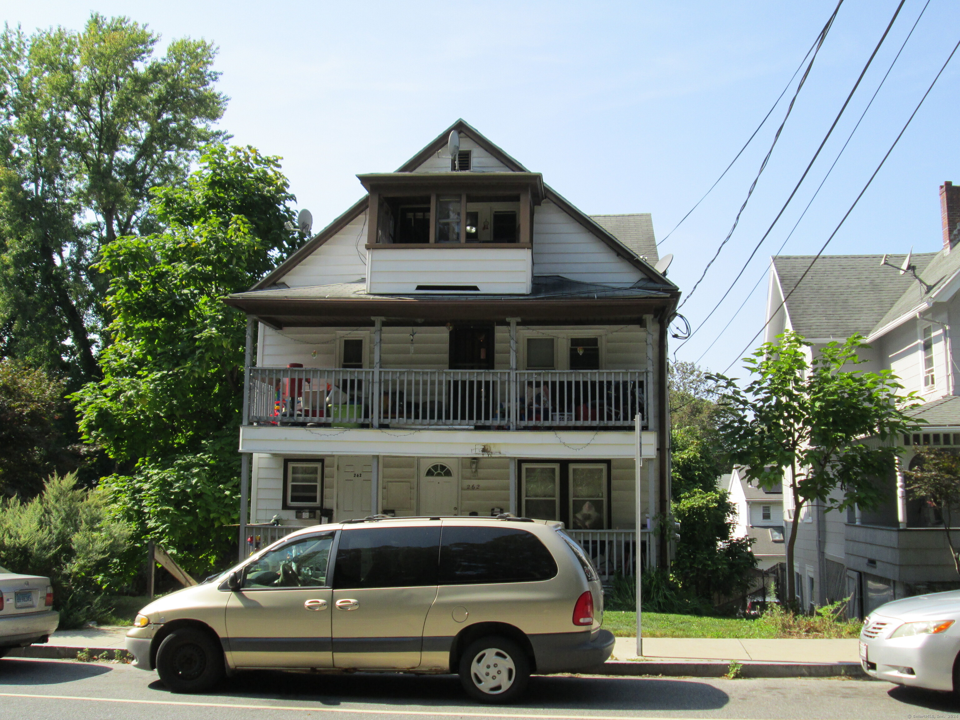 260 North Main Street Naugatuck, CT 06770 - Photo 1 of 1 a car parked in front of a house