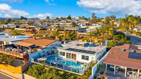 an aerial view of residential houses with outdoor space