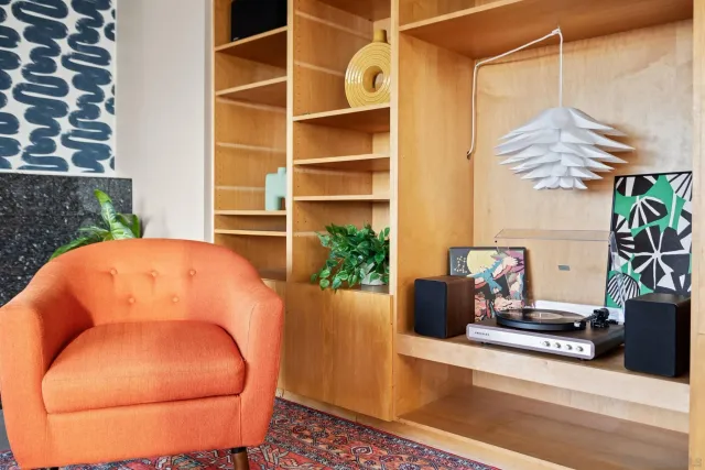 a living room with furniture and a potted plant