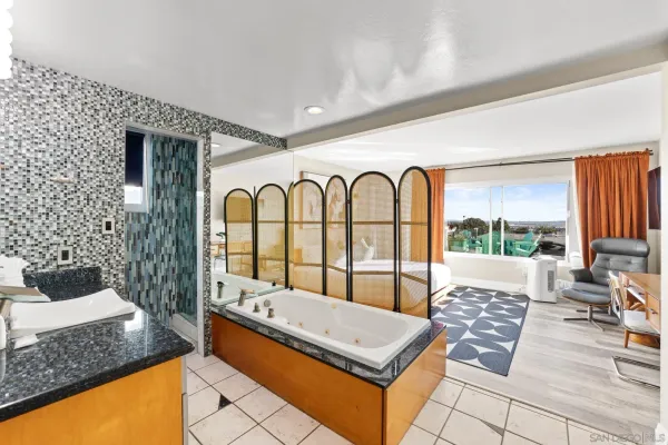 a view of a bathroom with a sink and a window