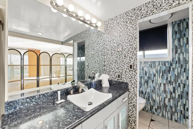 a bed room with a bed and a television