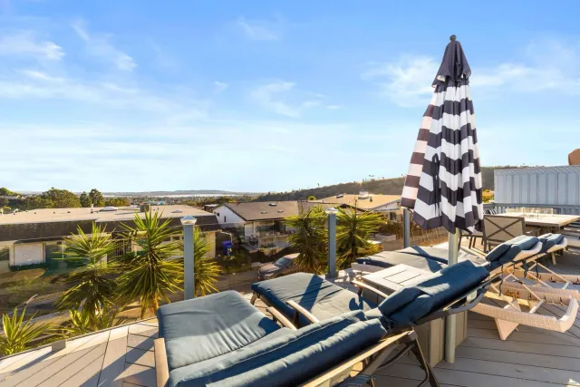 a view of a balcony with an outdoor seating
