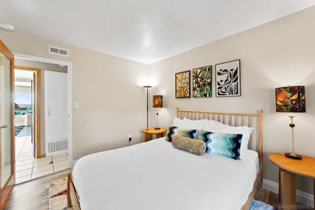 a bedroom with furniture and wooden floor