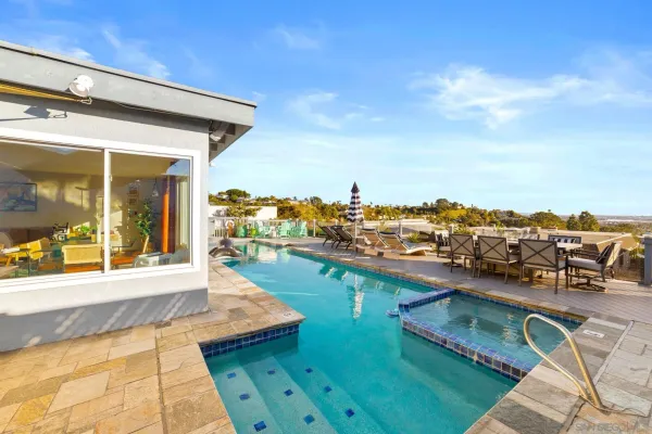 a view of a swimming pool with a lounge chair