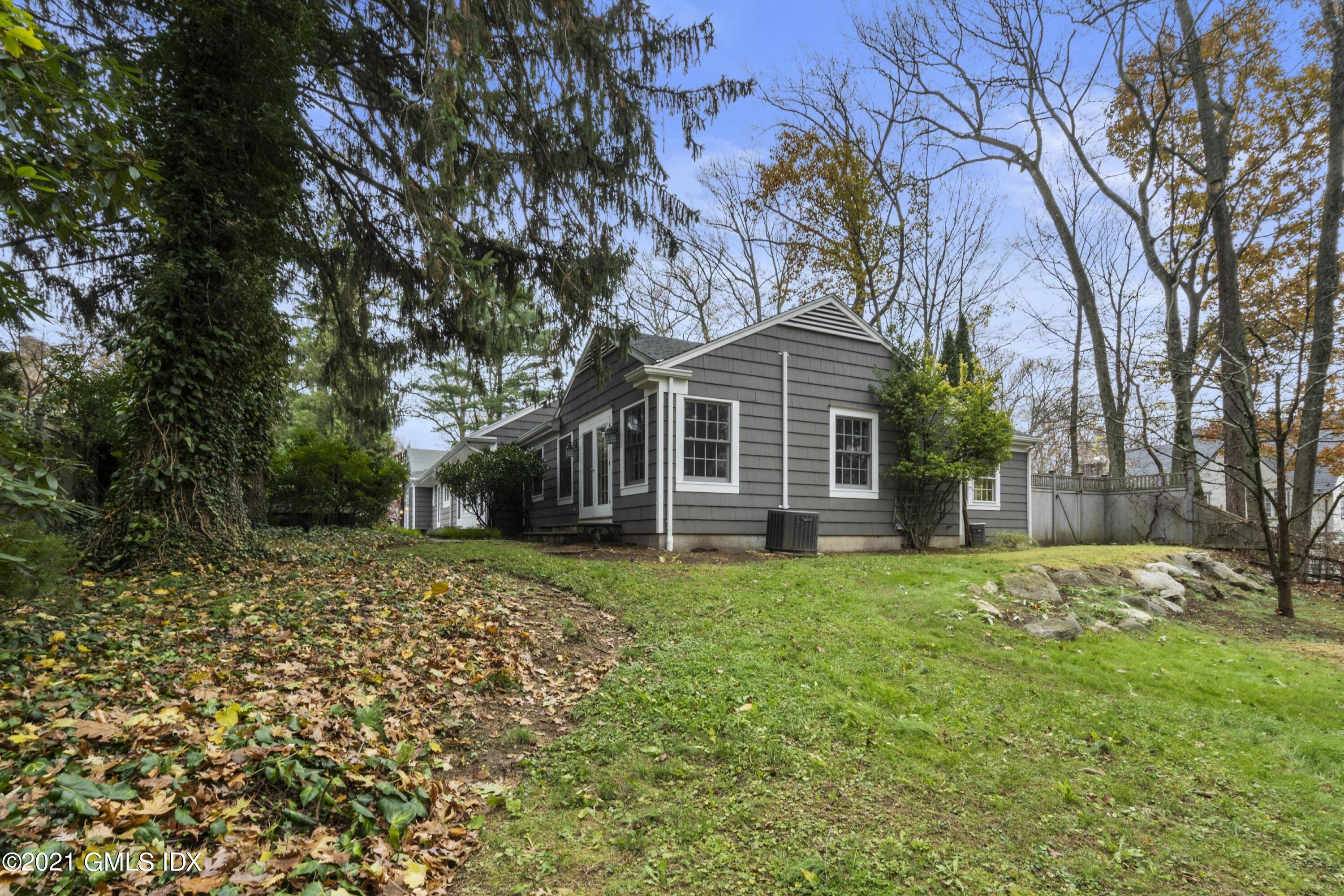 42 Indian Head Road Riverside, CT 06878 - Photo 37 of 47 a front view of a house with a yard