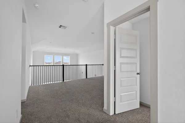 a view of a livingroom and entryway