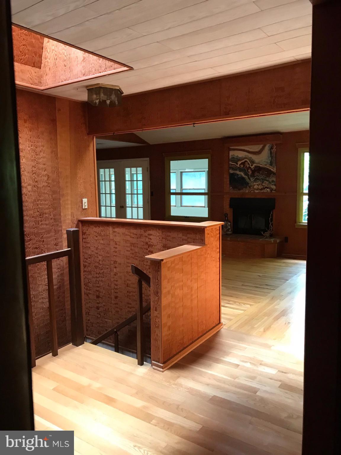 4010 Evergreen Road Port Republic, MD 20676 - Photo 22 of 33 Foyer and stairs to lower level