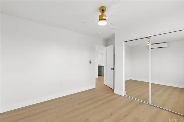 a view of a storage & utility room with wooden floor