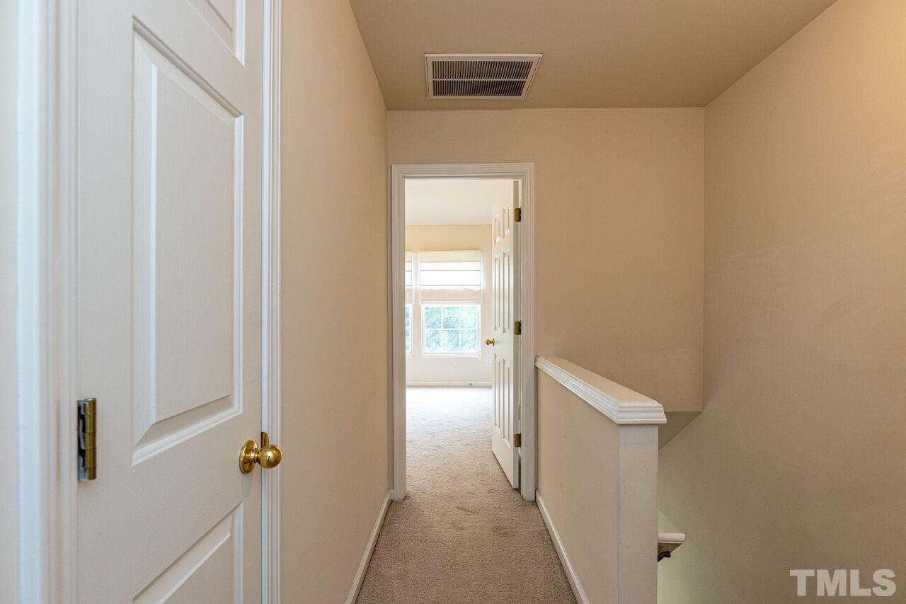 1730 Sorrell Brook Way Raleigh, NC 27609 - Photo 20 of 30 a view of a bathroom from a hallway
