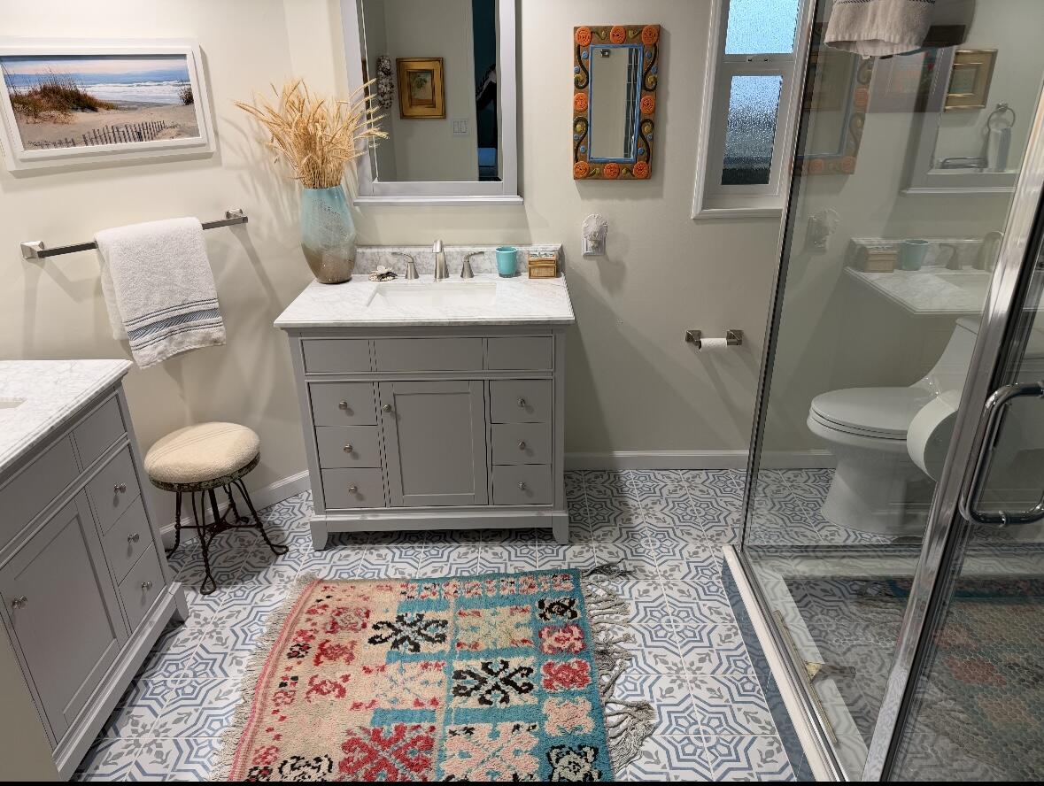 6180 Via Real, Unit 29 Carpinteria, CA 93013 - Photo 5 of 24 a bathroom with a sink a toilet and mirror
