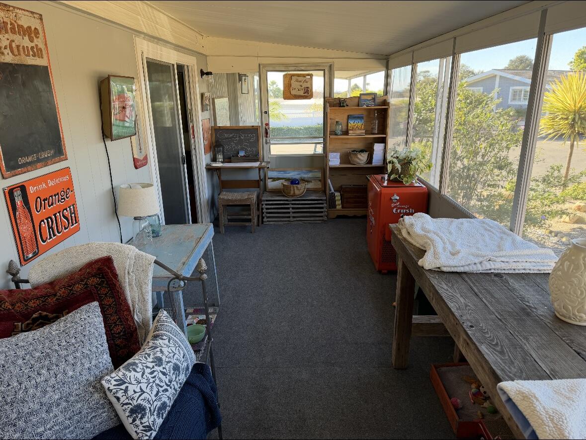 6180 Via Real, Unit 29 Carpinteria, CA 93013 - Photo 7 of 24 a living room with furniture and a floor to ceiling window