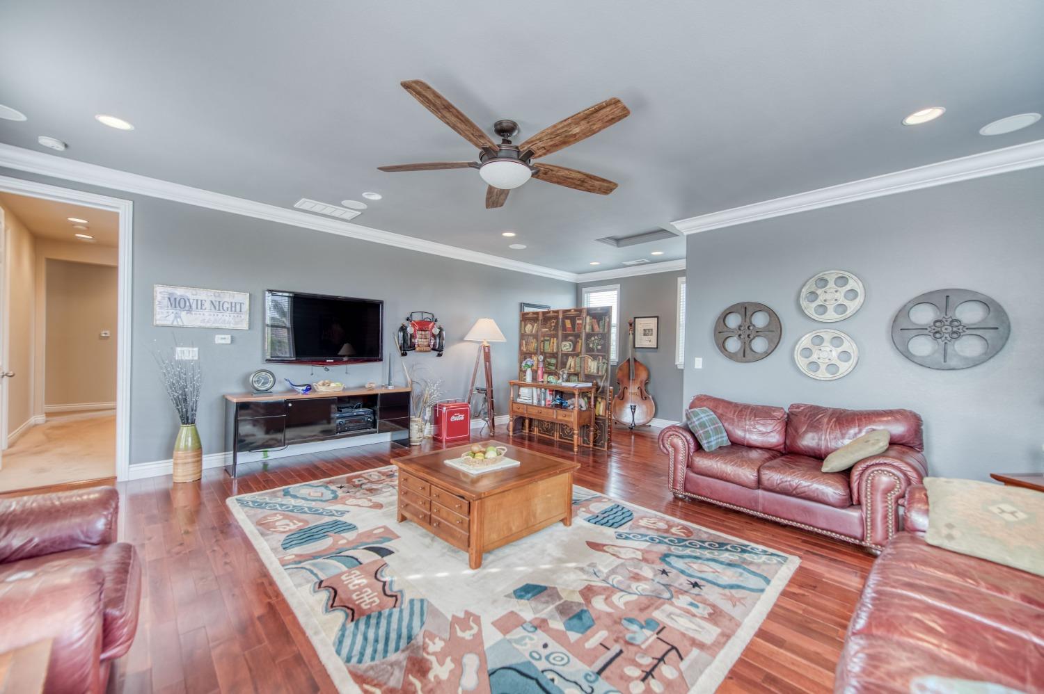 3207 Dennis Avenue Clovis, CA 93619 - Photo 31 of 55 a living room with furniture and a flat screen tv