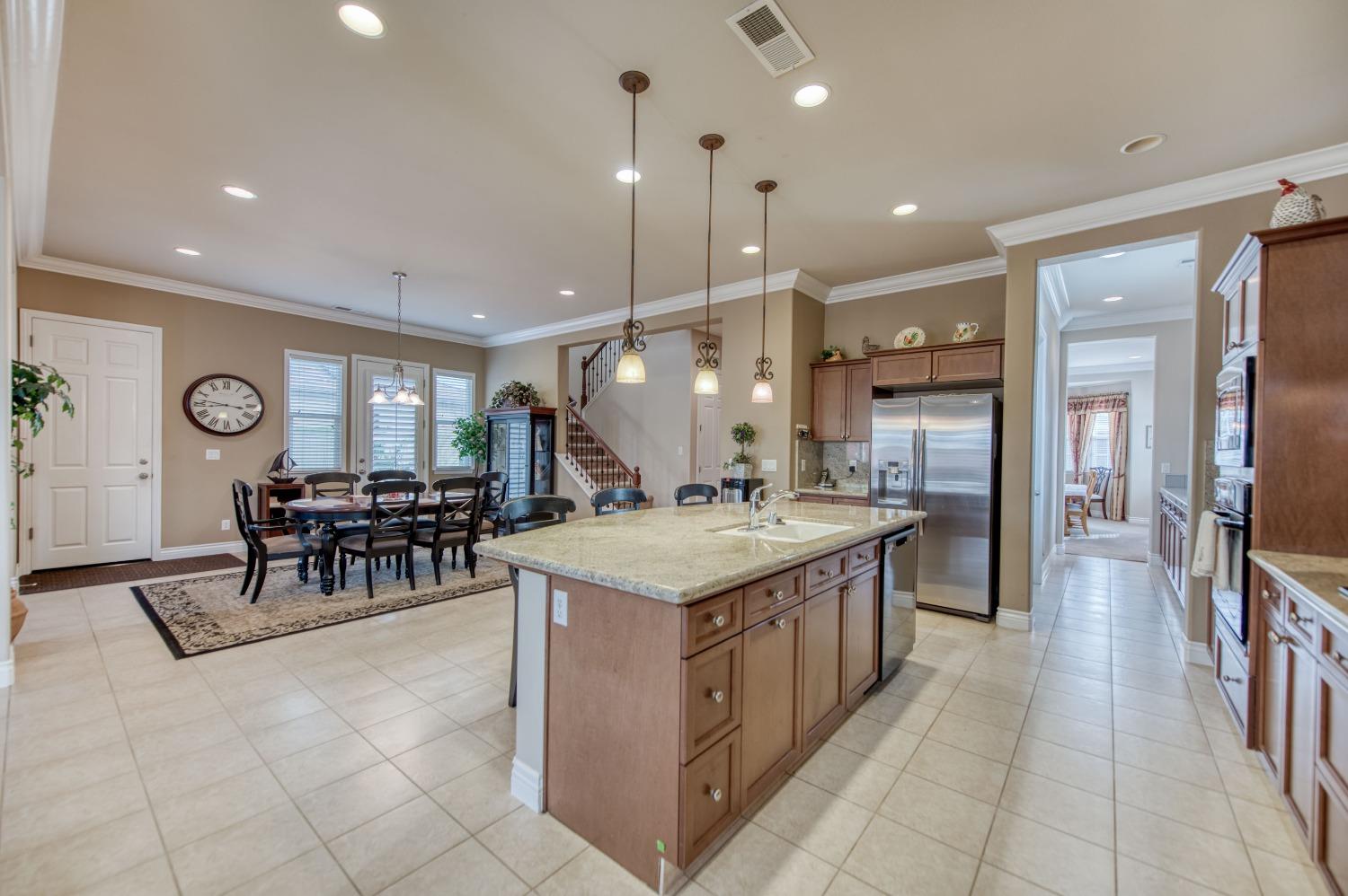 3207 Dennis Avenue Clovis, CA 93619 - Photo 36 of 55 a kitchen with lots of counter top space and chairs