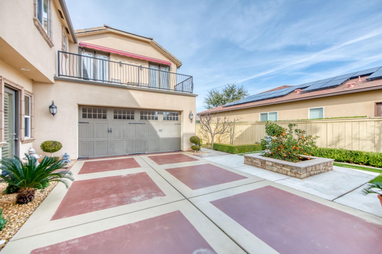 3207 Dennis Avenue Clovis, CA 93619 - Photo 6 of 55 a front view of a building with potted plants
