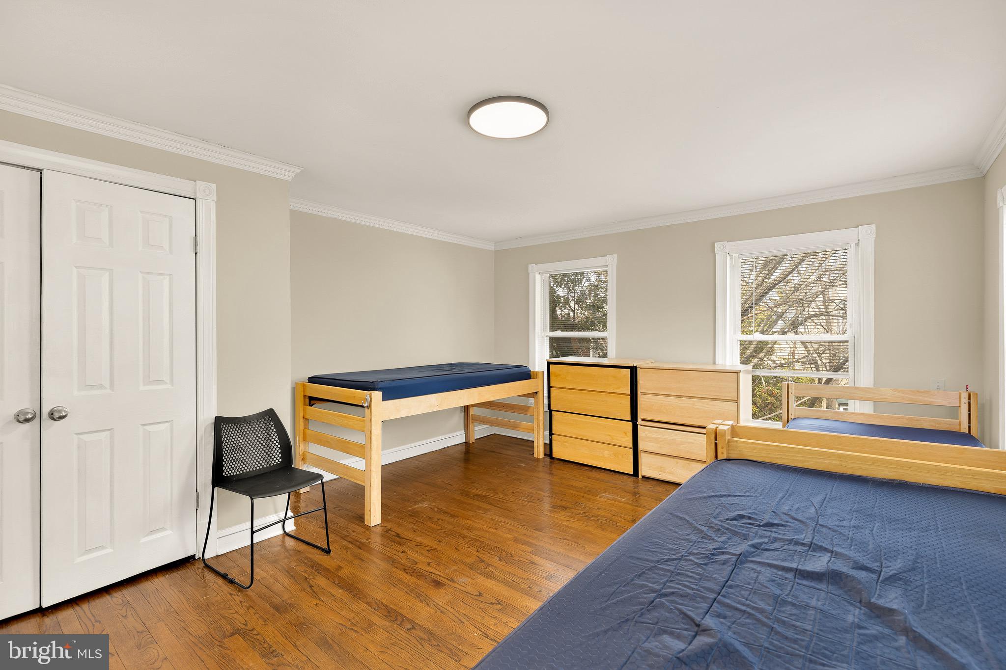 228 East Capitol Street Northeast Washington, DC 20003 - Photo 18 of 27 a bedroom with furniture and a window