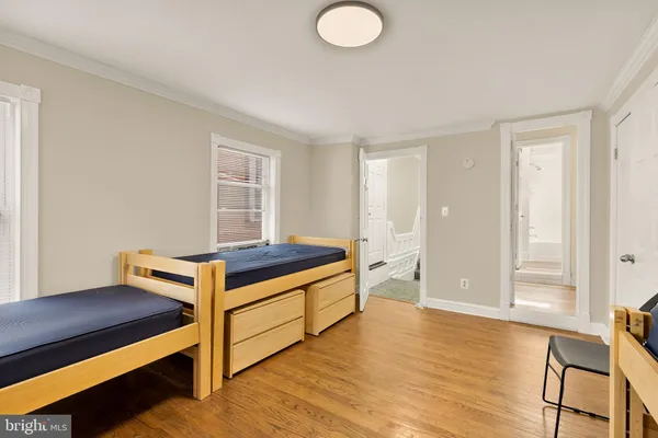 a room with wooden floor and furniture