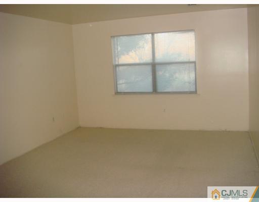 1630 Raspberry Court Edison, NJ 08817 - Photo 5 of 8 an empty room with a window
