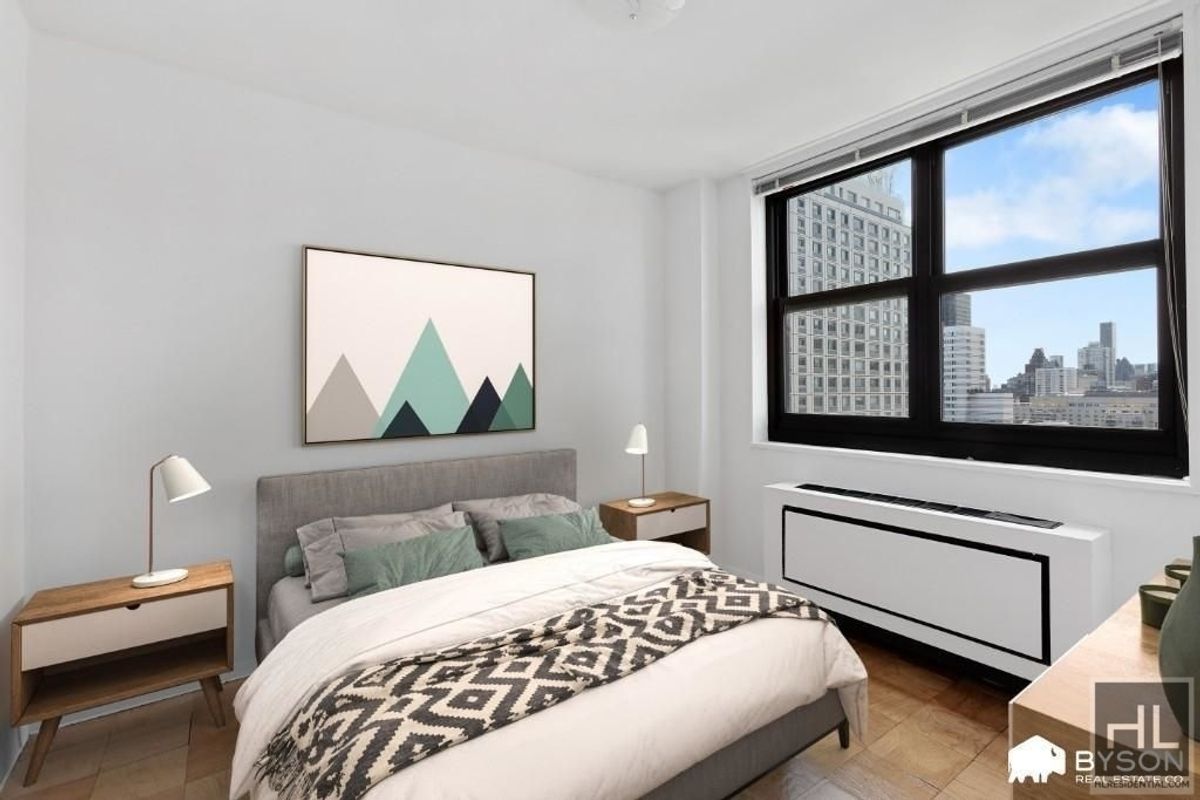 200 East 72nd Street, Unit 34N Manhattan, NY 10021 - Photo 3 of 12 a bedroom with a bed and a painting on the wall
