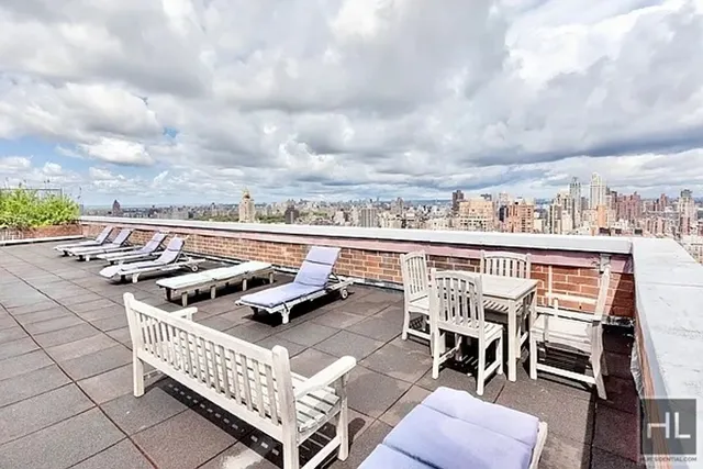 a roof deck with patio