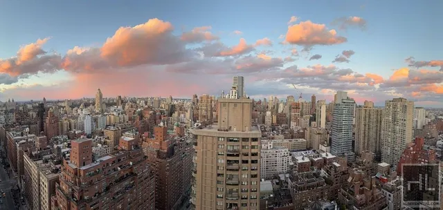 a view of a city with tall buildings