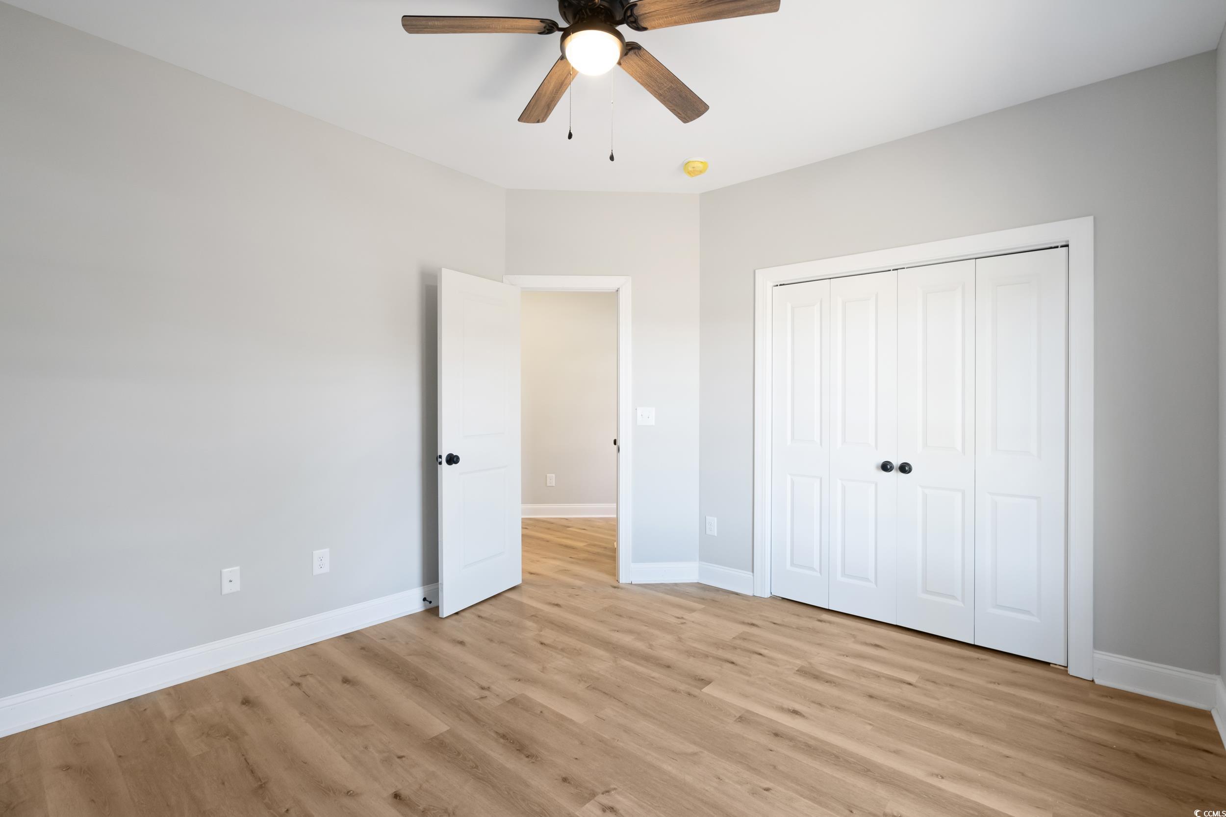 6174 Highway 66 Loris, SC 29569 - Photo 36 of 39 Unfurnished room with ceiling fan and light wood-t