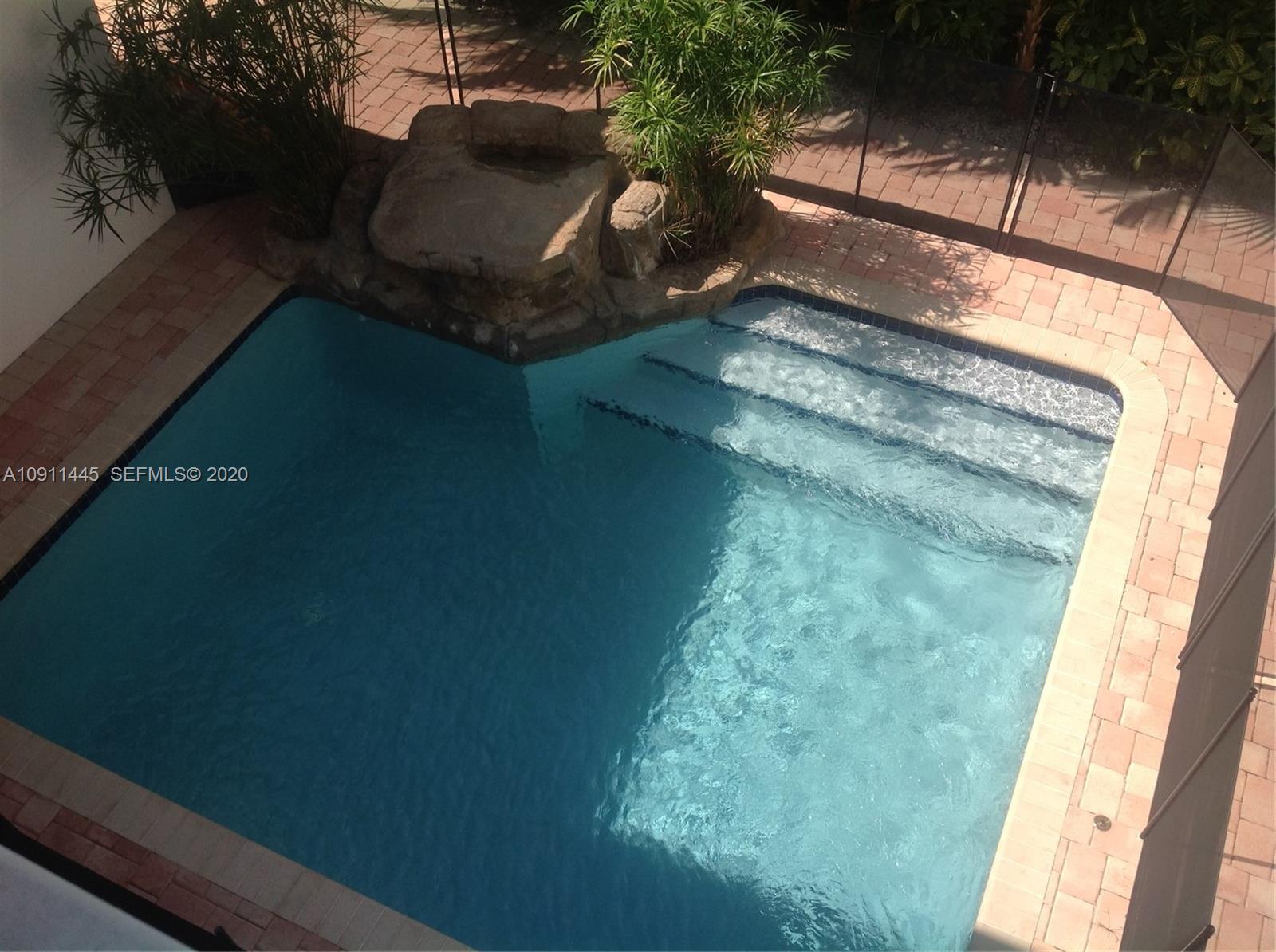 4 Turtle Walk, Unit 4 Key Biscayne, FL 33149 - Photo 12 of 54 a view of a balcony from a window