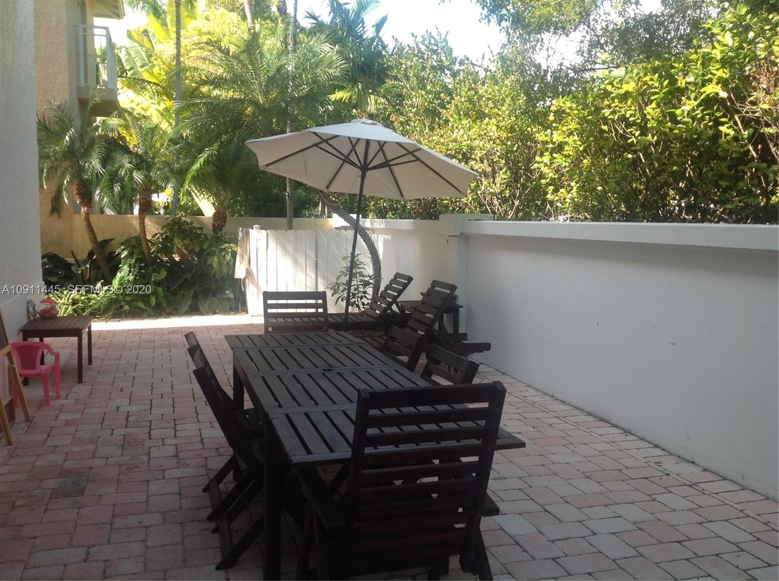 4 Turtle Walk, Unit 4 Key Biscayne, FL 33149 - Photo 14 of 54 a view of outdoor space yard and patio