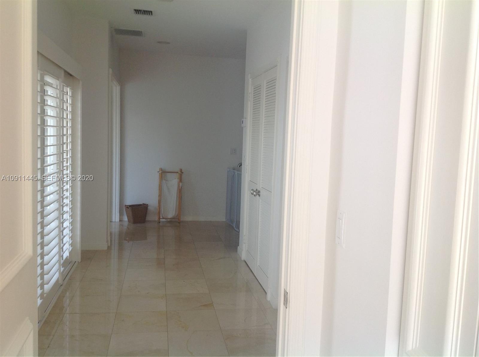 4 Turtle Walk, Unit 4 Key Biscayne, FL 33149 - Photo 33 of 54 a view of an empty room with a hallway