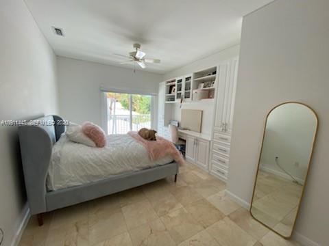4 Turtle Walk, Unit 4 Key Biscayne, FL 33149 - Photo 36 of 54 a spacious bedroom with a bed and a dresser