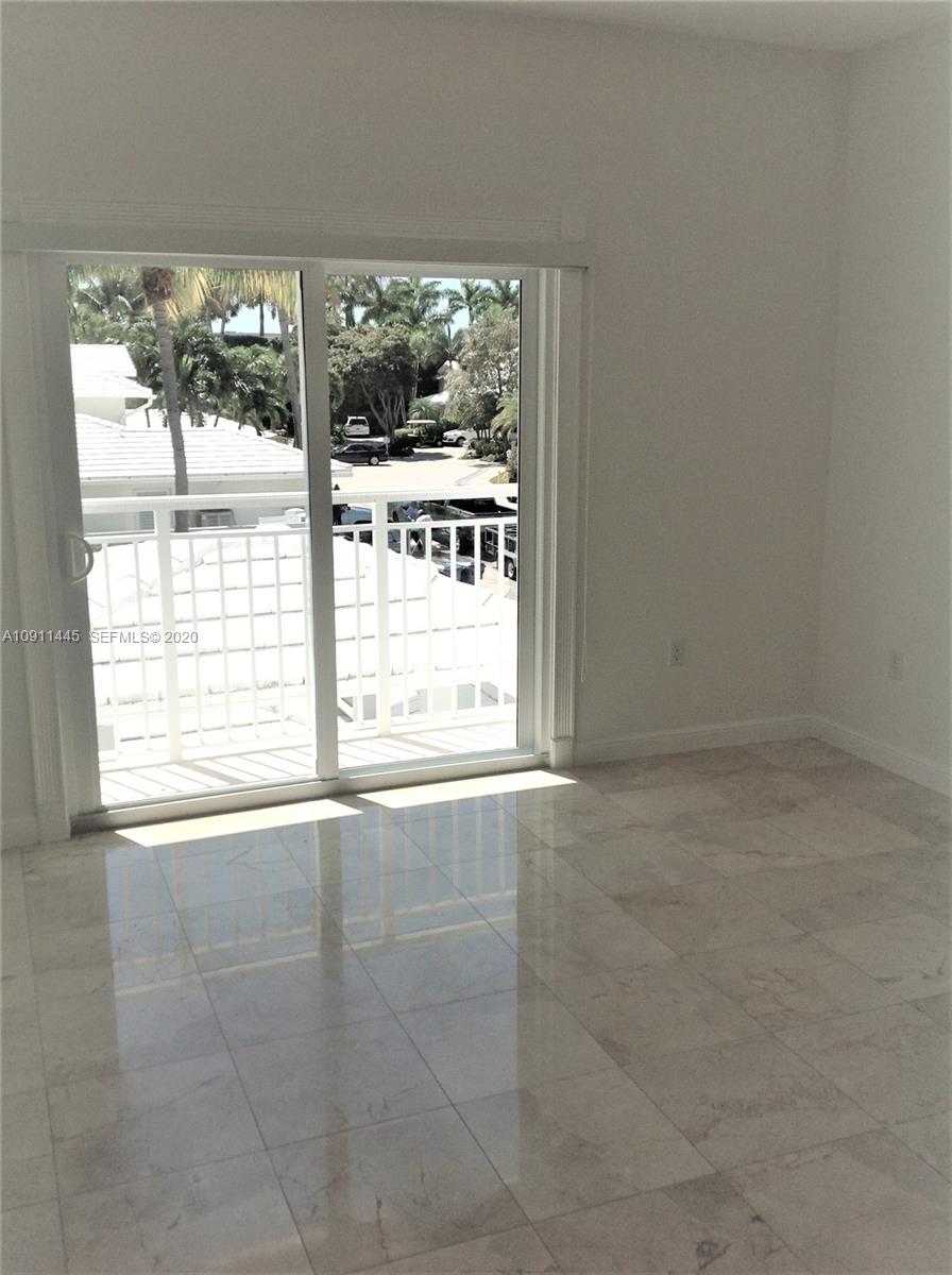 4 Turtle Walk, Unit 4 Key Biscayne, FL 33149 - Photo 37 of 54 a view of an empty room with a window