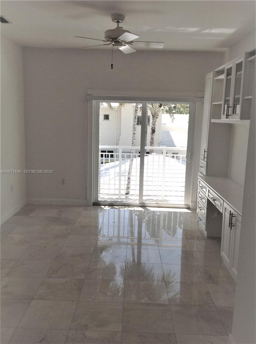 4 Turtle Walk, Unit 4 Key Biscayne, FL 33149 - Photo 38 of 54 a view of an empty room with a window