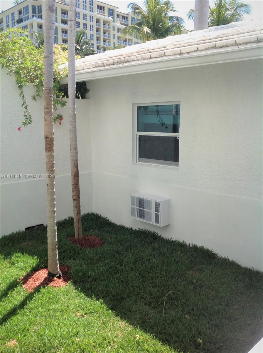 4 Turtle Walk, Unit 4 Key Biscayne, FL 33149 - Photo 48 of 54 a backyard of a house with lots of green space