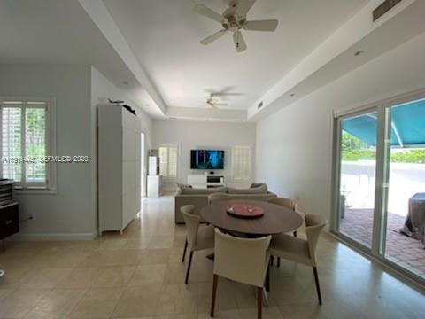 4 Turtle Walk, Unit 4 Key Biscayne, FL 33149 - Photo 5 of 54 a view of a dining room with furniture and a livingroom