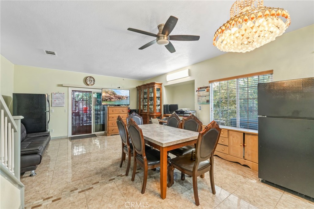 1553 West Ceres Street Rialto, CA 92376 - Photo 13 of 73 a dining room with furniture and window