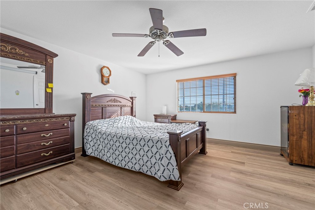 1553 West Ceres Street Rialto, CA 92376 - Photo 23 of 73 a bedroom with a bed and a window