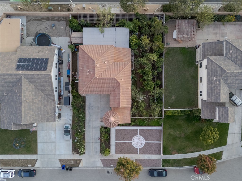 1553 West Ceres Street Rialto, CA 92376 - Photo 35 of 73 an aerial view of a house with a yard and a large tree