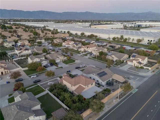 a view of a patio with table and chairs and potted plants