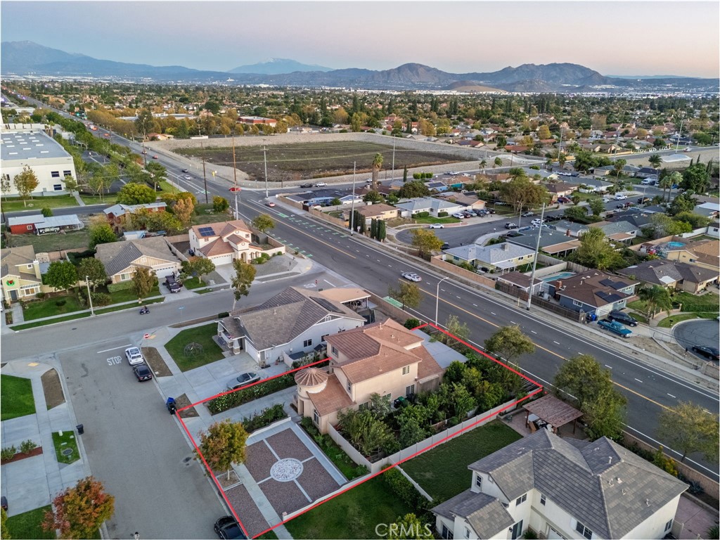 1553 West Ceres Street Rialto, CA 92376 - Photo 41 of 73 an aerial view of a city with lots of residential buildings ocean and mountain view in back
