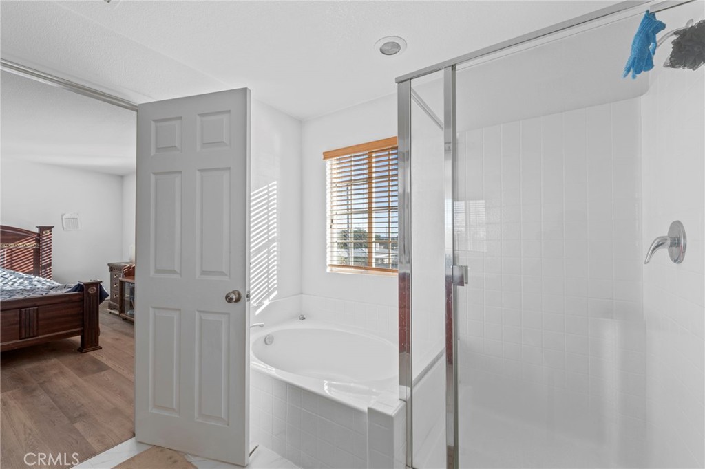 1553 West Ceres Street Rialto, CA 92376 - Photo 60 of 73 a bathroom with a bathtub and a shower