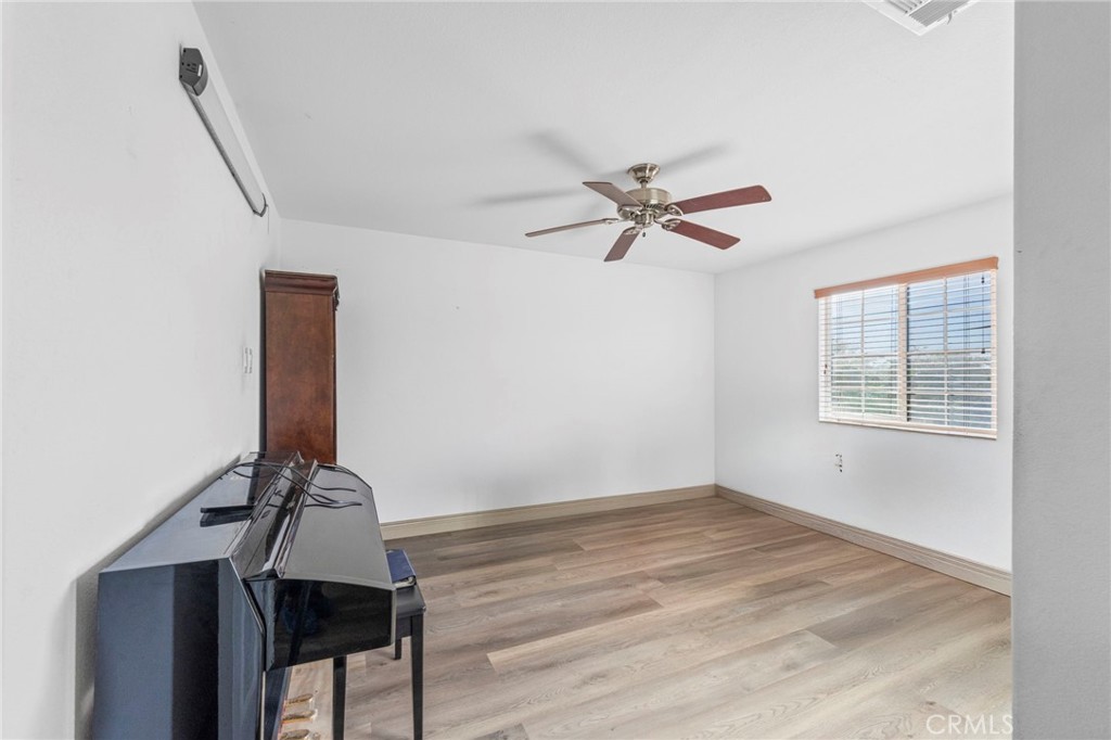 1553 West Ceres Street Rialto, CA 92376 - Photo 6 of 73 a view of room with workspace and a window