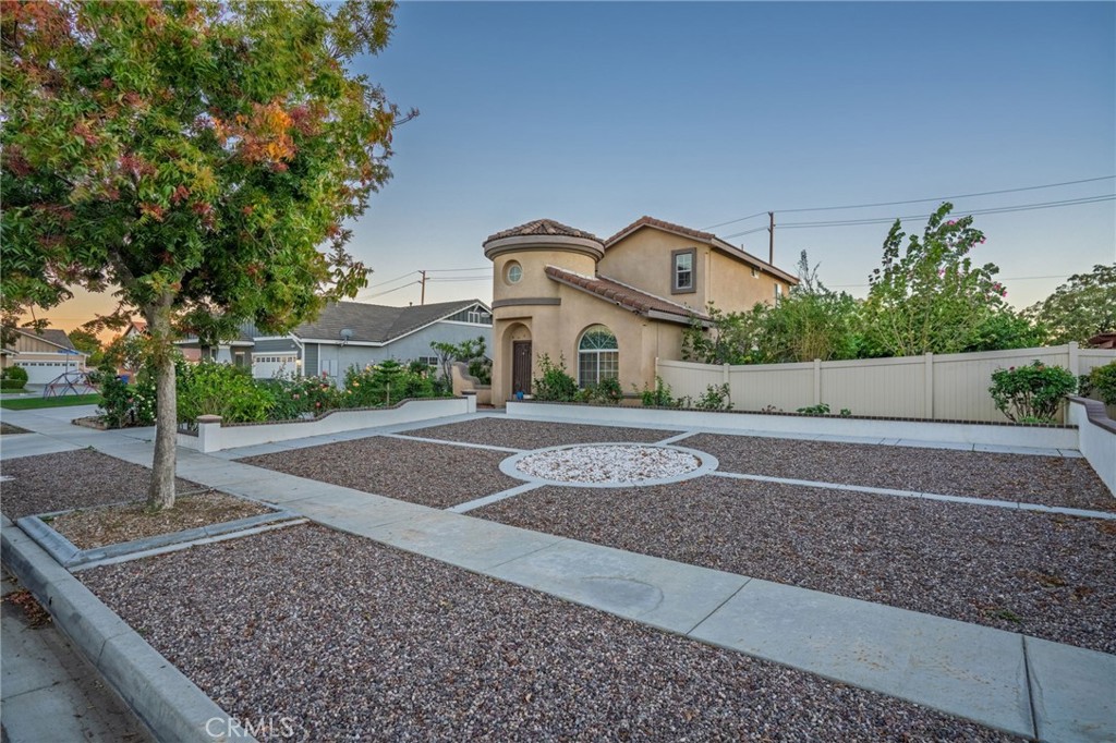 1553 West Ceres Street Rialto, CA 92376 - Photo 70 of 73 a front view of a house with a yard